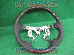 Unknown Manufacturer
Gun grip steering
Punching leather x black carbon
Number: 45103-12590