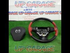 MAZDA
Leather steering wheel
RX-8
SE3P
Previous period
Leather steering wheel red/black
