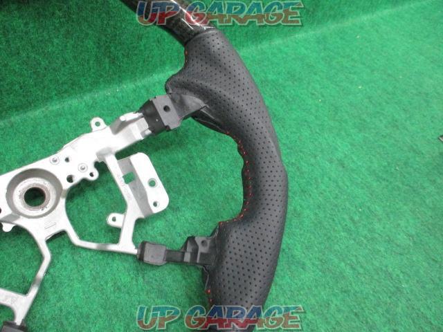 Unknown Manufacturer
Gun grip steering
Punching leather x black carbon
Number: 45103-12590-03