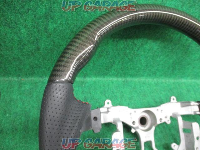 Unknown Manufacturer
Gun grip steering
Punching leather x black carbon
Number: 45103-12590-04
