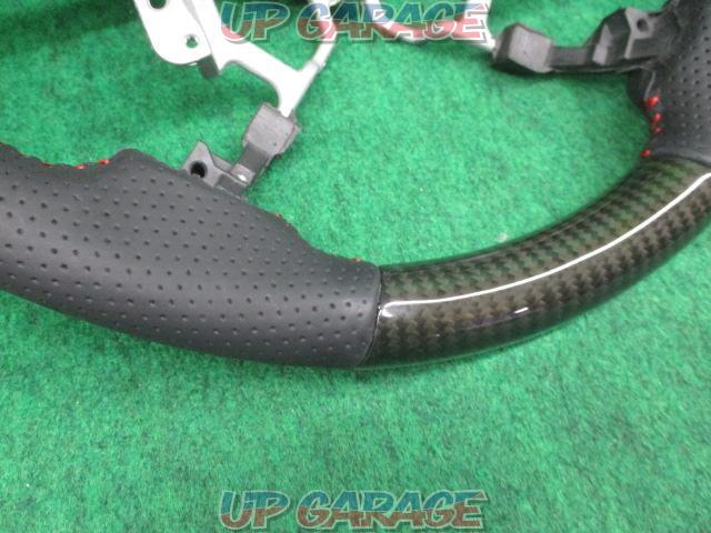 Unknown Manufacturer
Gun grip steering
Punching leather x black carbon
Number: 45103-12590-05